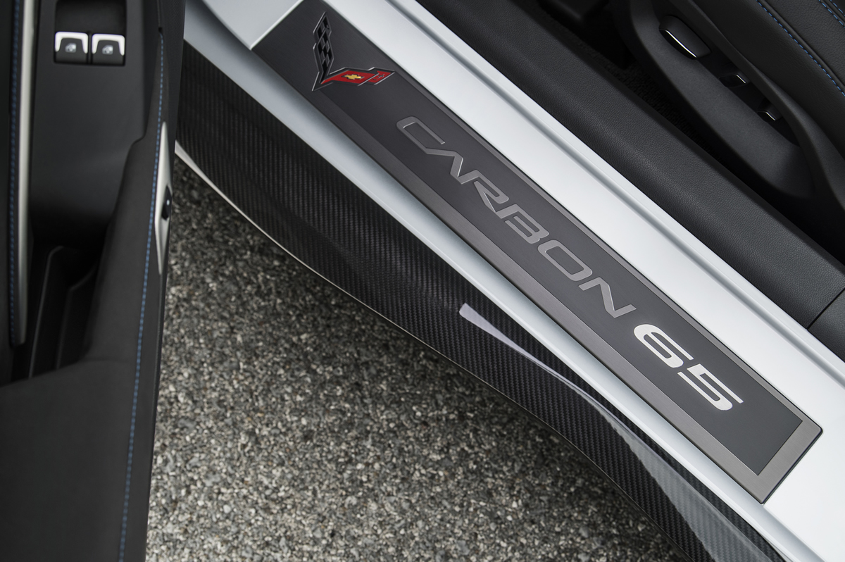 Exclusive Carbon 65 sill plates greet driver and passenger.