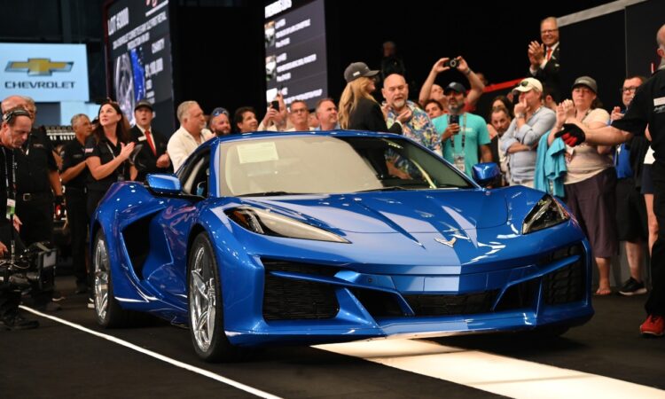 Front 3/4 View Of 2024 Chevrolet Corvette E-Ray In Riptide Blue Crossing The Auction Block At The 2023 Barrett-Jackson Palm Beach Auction.